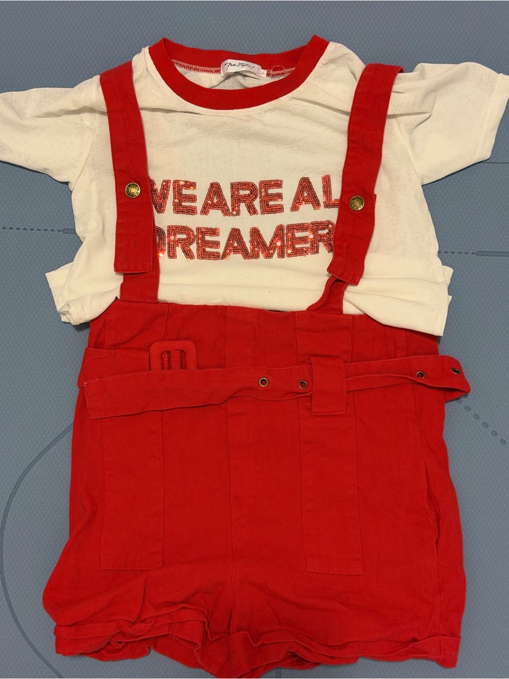 Red Suspender Shorts with White 'We Are All Dreamers' Tee